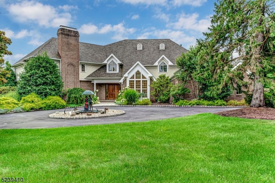 Located in one of the most prestigious and sought-after neighborhoods, 4 Ponds Edge Lane offers 5 bedrooms, 5 1/2 bathrooms set on 1.4 acres of impeccably manicured landscaping and over 7000 sq ft of quality materials, custom details and luxury finishes. The heart of the home is the dramatic 2 story family room with floor to ceiling windows, gas fireplace and vaulted ceiling which flows into the spacious eat-in kitchen and covered paver patio deck perfect for entertaining and living! The main level includes elevator, formal dining room with cathedral ceiling, formal living room and library with wood burning fireplaces as well as a first floor bedroom with en-suite bathroom and walk-in closet. The second floor includes two large light-filled primary suites each with en-suite bathroom and walk-in closet, and two additional secondary bedrooms overlooking the private back yard. The finished walk-out basement has high ceilings, full bathroom, and tons of room for storage.  Other highlights: new Kohler whole house natural gas generator with automatic transfer switch 2020, new Timberline roof 2017, new Hardi Board siding 2017, new water heaters 2022/2017, refinished white oak hardwood flooring throughout (2023), 3 car attached garage. Public water, public sewer.