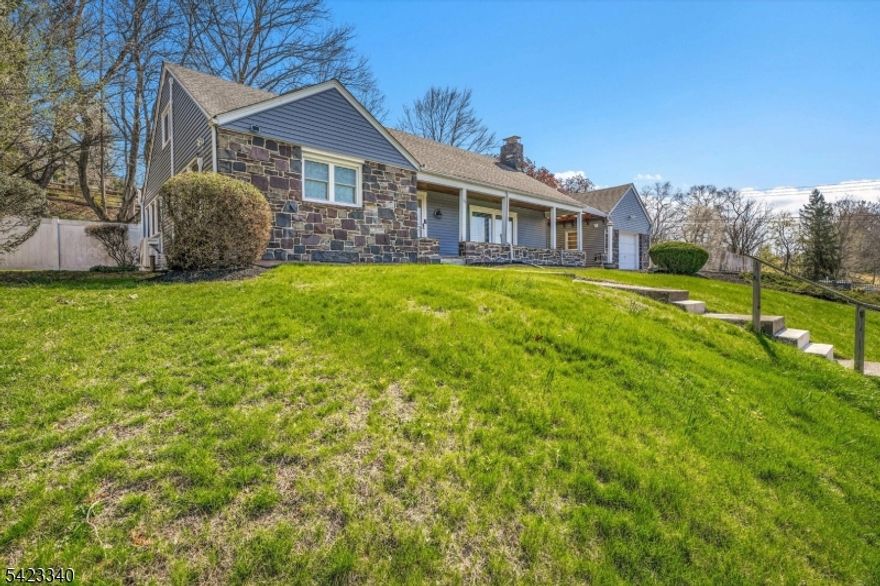 Nestled above on a scenic hill overlooking the charming town of Milford, this well-built Cape Cod offers a perfect blend of character and modern updates. The home features updated kitchen and baths (2015), along with newer laminate flooring and a cozy wood-burning fireplace. The kitchen is designed with quality in mind, showcasing Craftsman soft-close cabinetry, a tile backsplash, undermount double sink, and distinctive recycled glass countertops.  Additional highlights include an enclosed sunroom, welcoming front porch, upstairs sitting area, first-floor bedroom, first-floor laundry, and abundant storage throughout. Thermopane windows have been updated for improved efficiency.  For hobbyists or those needing workspace, the property offers two dedicated workshop areas one in the garage and another in the basement. A newer Weil-McLain boiler (2015) adds to the home's reliability.  The fully fenced yard provides privacy and outdoor enjoyment, while the location offers convenient walking access to schools, shops, restaurants, and the Delaware River.  Recent improvements include vinyl siding, updated laminate flooring, and mini-split ductless A/C units. Public water and sewer complete the package.  Move-in ready don't miss this opportunity!