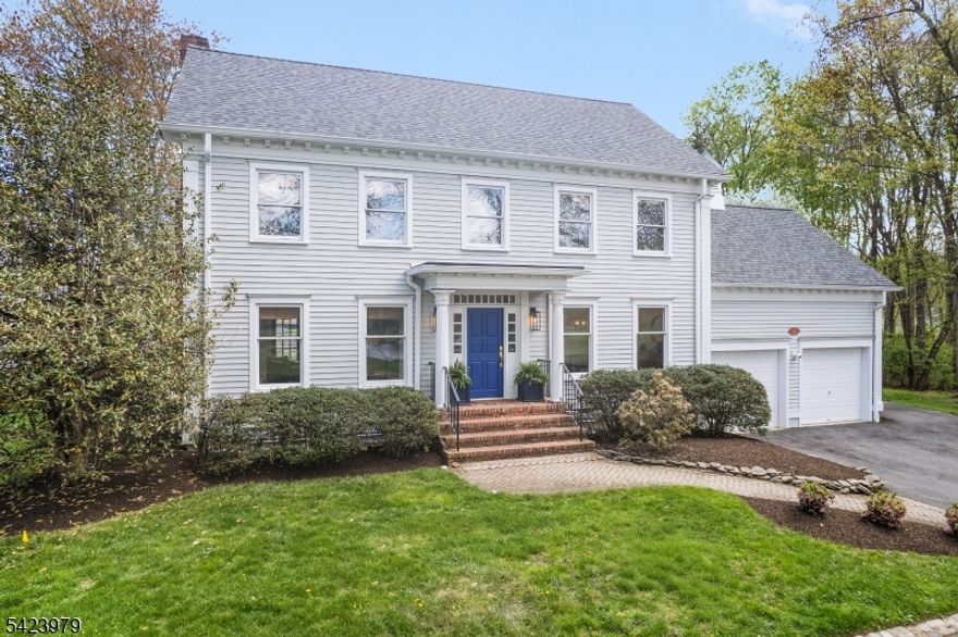 Welcome to "Lake View"- a flawless three-story lakeside Custom Colonial that personifies grace & practicality- brimming with special design features &  expert craftsmanship - sited at the very end of Lake Road in the coveted Sunset Lake section of Chatham Twp with scenic lake, golf course, and park views from every room.  12 rooms including 6 bedrooms, 5 full baths, newly renovated powder room, 2 fireplaces, & many coveted features including rich custom millworker, stylish lighting, volume ceilings, abundant closets, specialty windows including skylights, wainscoting & refinished hardwood flooring throughout; gorgeous designer kitchen has custom cabinetry, granite countertops, newer stainless steel appliances, breakfast bar w galley seating & walk-in pantry; open floor plan gathering room features gas fireplace, wall of windows w views of Sunset Lake extending into adjoining kitchen, & easy access to patio. handsome den/home office, tasteful dining room w views of golf course; service area w mudroom & door to garage or rear yard; lovely powder room & discreet access to guest suite with full bath. 2nd floor features 3 spacious bedrooms & 2 full baths including primary suite, 3rd floor offers 2 additional bedrooms and full bath. The upper 3 floors offer 3,030 sq ft plus there is a sprawling finished lower level w full bath. 2-car attached garage, Telsa EV charger, public utilities, new roof, footpath to Castle Park, steps to Hickory Tree Shopping Center& walk to train