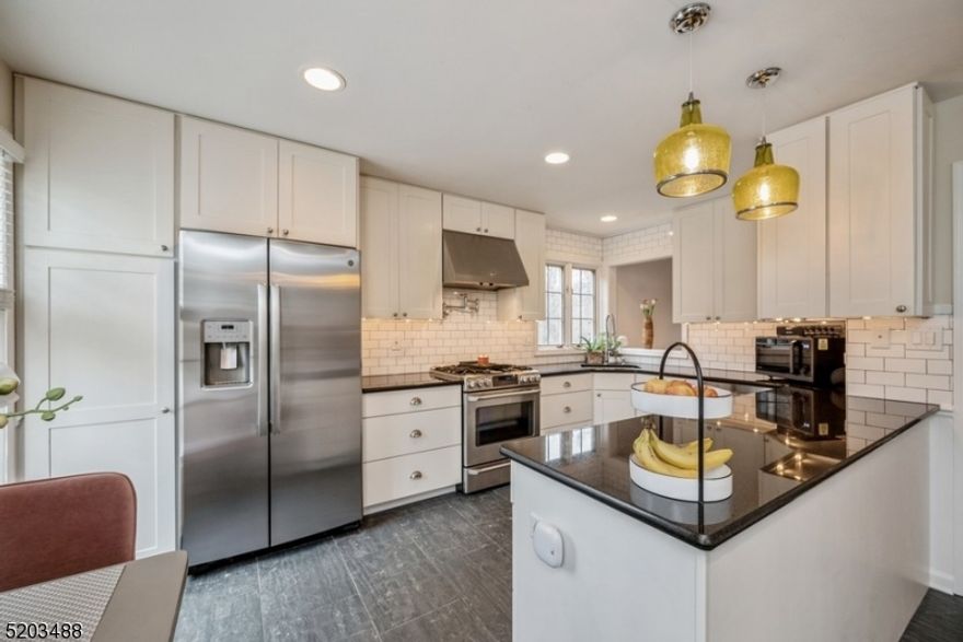 A world of elegance and prestige awaits you in the sought-after Florham on the Fairways community surrounded by woodlands offering beautiful views and peaceful privacy. This 2 bedroom townhome with 3 full bathrooms + 2 half bathrooms is tucked into a quiet cul-de-sac in a 40-acre complex next to the Brooklake Country Club. It is just minutes to the Midtown Direct train to NYC & close to the center of town. Highlights include an open floor plan, fully renovated & move-in ready, with high ceilings, finished walk-out basement, oversized windows, an attached 2 car garage, a gas fireplace, and a private deck with treetop views. A 2 story foyer with a graceful staircase opens to a spacious living room that is perfect for entertaining with a fireplace, a wet bar, and access to the deck. The formal dining area flows to the elegant eat-in kitchen appointed with granite counters, tile backsplash, SS appliances, and crisp white cabinets. The adjacent family room has a wall of built-in cabinetry and counter space, wainscoting, and views of the landscaped grounds. A powder room completes the main level. The second floor offers a lavish primary bedroom with two en suite bathrooms and two walk-in closets. This level includes an additional bedroom with a full en suite bathroom, and a laundry room, while the third floor features a loft study/office space and copious attic storage. A recreation room in the finished basement includes a half bathroom, and extra storage complete the package.