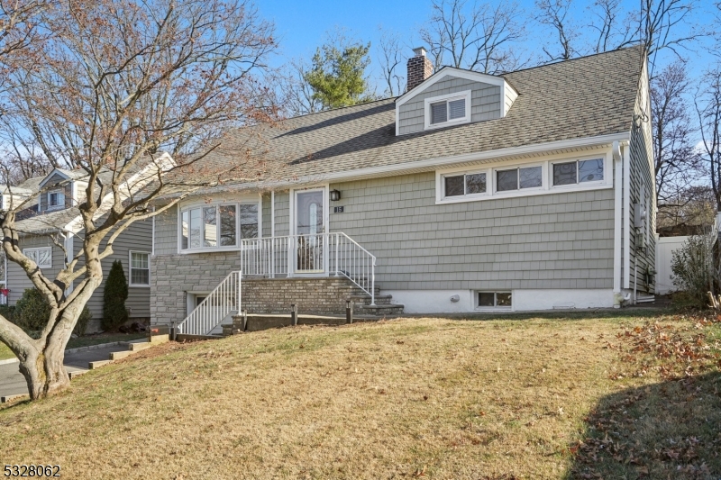 Welcome to this beautifully updated rental home, featuring a modern kitchen outfitted with stylish wood cabinets and premium appliances. Sunlight pours through the updated windows, illuminating the stunning Brazilian hardwood floors that flow seamlessly throughout the main level. Step outside to enjoy the spacious deck and patio, perfectly set against a peaceful, fenced-in backyard. With recessed lighting throughout, this home exudes modern charm and sophistication, creating the ideal space for relaxation and enjoyment. Close to local shopping centers and transportation to NYC.