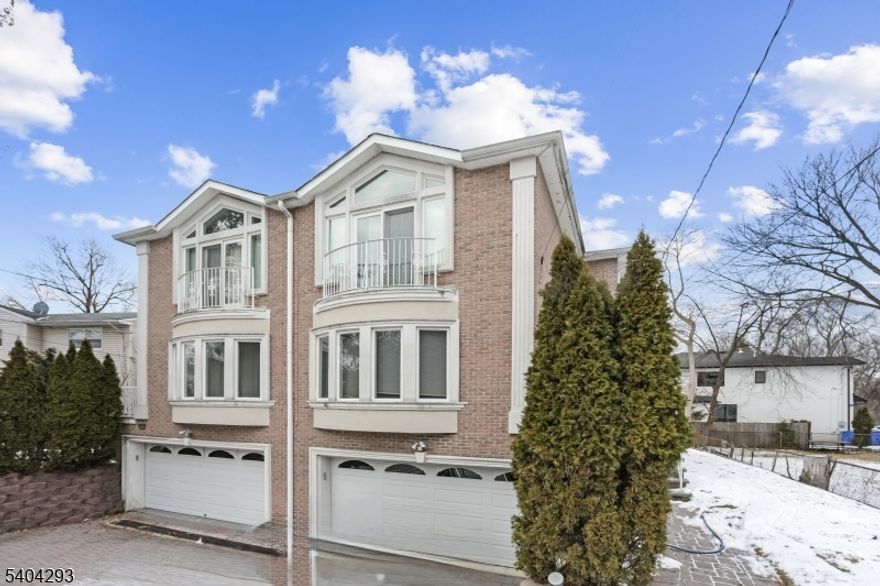 Well-maintained and spacious townhouse rental featuring 3 bedrooms and 3.5 bathrooms, located in the highly desirable town of Tenafly, known for its Blue Ribbon schools and convenient access to NYC. The main level offers an open-concept living and dining area, along with an eat-in kitchen complete with a breakfast bar, granite countertops, stainless steel appliances, and sliding doors that lead to a private deck and backyard. The top level includes three generously sized bedrooms and two full bathrooms. The lower-level den offers an additional full bathroom, a dedicated laundry room, and direct access to the two-car garage. Additional highlights include hardwood floors throughout, recessed lighting, abundant closet space, and extra driveway parking. Tenant is responsible for all utilities and snow removal. Landscaping is maintained by the landlord. Credit check, proof of income, and ID are required. A small pet may be considered.