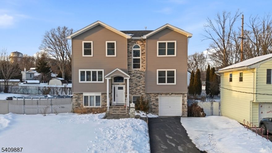 Welcome to this spacious and beautifully updated 6-bedroom, 4-bath home offering approximately 3,300 sq ft of living space on an almost 9,000 sq ft lot. Renovated in 2019, this home delivers the perfect blend of modern updates and functional design. The main living areas feature gleaming hardwood floors, recessed lighting, and an open, airy layout ideal for everyday living and entertaining. The updated kitchen showcases rich cabinetry, granite countertops, ample storage, and a center island that flows seamlessly into the dining and living spaces. Generously sized bedrooms, including a large primary suite, provide flexibility for guests or home office needs. Multiple bathrooms across levels add convenience and comfort. The finished lower level offers additional living space perfect for recreation, guests. Outside, enjoy a private yard, ample parking, and low-maintenance exterior features. Conveniently located near major highways, shopping, schools, and public transportation. A true move-in-ready home with size, updates, and versatility. this one checks all the boxes.