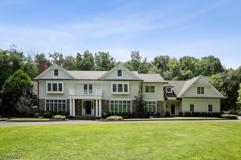 Exceptional Custom Colonial home with unparalleled workmanship and amenities, nestled on 7.5 acres on a private cul-de-sac in a desirable New Vernon neighborhood. Light streams into its opulent rooms through oversized windows, highlighting superb millwork, high ceilings, custom paneling, and gorgeous oak floors. Gourmet kitchen has thick marble countertops, two sinks, and top of the line appliances.  The two-story conservatory, magnificent paneled library, and five gas fireplaces create a unique retreat and fabulous home for entertaining. The finished, walk-out basement boasts a media room, exercise room and recreation room with a fireplace.  The enormous master suite contains large sitting room, walk-in closets, and spa-like bath.  Home is close to trains to NYC and has low taxes and excellent school system.