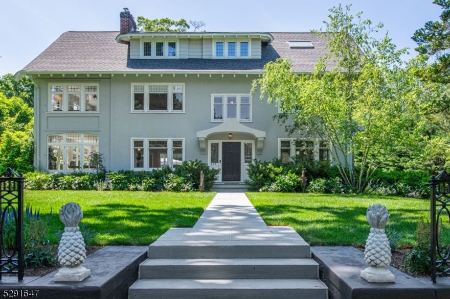 Exquisite Craftsman Colonial with prime in-town location on highly sought after street. Exceptionally designed by RHG Architecture & meticulously renovated by Jack Finn 10 years ago. Modern updates & whimsical custom finishes blend seamlessly w/ gorgeous period architecture throughout. This stunning 5,000+ SF, 6 BR, 4.2 BA home offers an open fl. plan perfect for entertaining w/ 4 levels of expansively scaled rooms. Updates include: sleek modern eat-in kitchen w/ 15' island, limestone counter tops, high-end appliances, custom cabinetry & walk-in pantry. Mudroom off kitchen. Stunning 725 SF rear family room addition w/ vaulted ceiling, breathtaking floating glass staircase & custom floor-to-ceiling sliding doors that combine indoor & outdoor spaces leading to 2 patios & heated salt water in-ground pool. Primary suite offers: huge bedroom; luxurious bath w/steam shower, double sink vanity, heated towel rack & radiant floor; and sun-drenched dressing/sitting room w/ cedar closets & fireplace. Lg. DR w/ beautiful cove ceiling, built-ins & custom paint. Lg.  rec-room, sound proofed music room & powder room. 10 year old: roof, sewer & gas lines, chimney liner, electrical wiring, foundation & bsmnt. Private, lushly landscaped .59 acre property. Charming carriage house w/ electricity, water & gas lines has one room & orig. bath above 2 car garage. A short stroll to Watchung Plaza shops, restaurants and NYC train. An amazing opportunity to own a very special, one of a kind home!