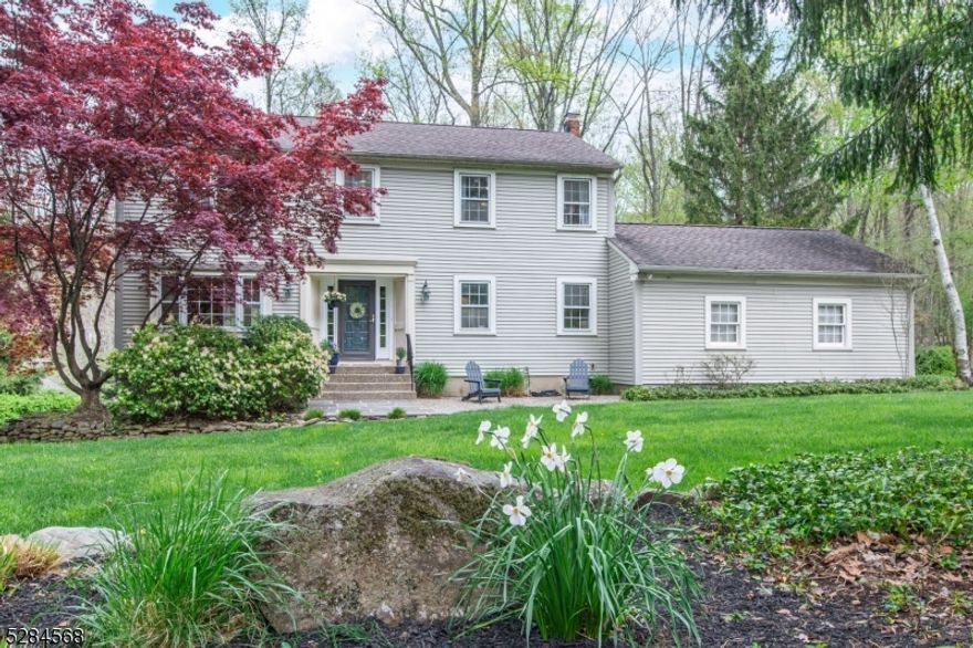 Great 4BR 3 Full & 2 Half Bath Center Hall Colonial in the heart of Shongum Lake! This unique home offers a larger floor plan than other 4BR homes in the neighborhood. Large front to back Living Room with Hardwood floors, gas fireplace & door to deck. The spacious Dining Room is currently being used as an office. Generously sized Kitchen offers a walk-in pantry off the mud-room. Family room and full bath are tucked away and can be used as a guest/in-law suite on the main level. Walk in from the 2 car garage right into the mud-room & kitchen with your groceries. The primary suite is spacious & offers 3 large closets & full bath. The walkout partially finished basement is the ideal hangout spot. Hardwood floors throughout most of the home. The property is breathtaking! The front yard has Beautiful curb appeal! The backyard is a true sanctuary! Enjoy the elevated deck overlooking the woods, or sit by the stream and around the fire pit and enjoy true serenity right in your backyard! Great opportunity to move into this very sought-after neighborhood and make this home your own!  Walk to Shongum Lake beach from this prime location. The Shongum Lake Community features a clubhouse, beach, boating, swimming, and a full calendar of social events. Public utilities. Award winning Randolph Schools. Close to highways and public transportation.