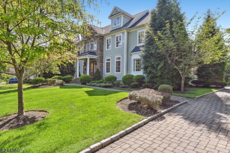 Essential elements of this modern Colonial, circa 2010, creates a residence conducive for formal entertaining, while accommodating casual living style. First impression is the open, flowing floor plan along with sophisticated architectural amenities featured in elaborate millwork, hardwood floors, higher ceilings, spacious rooms , as well as a front and side staircase. The image of the residence expresses its own personality in the luxurious scale and proportions. First Floor features a Living Room, Dining Room, Family Room with a gas fireplace, Guest Room and Hall Bathroom.  The heart of the home is a Chef's Kitchen with Center Island  and Breakfast Area distinguished by clean lines of custom white cabinetry, high-end stainless steel appliances, marble subway tiled backsplash and numerous stone workstations. Second Floor offers a sumptuous Primary Suite  with Bedroom, Bathroom, Dressing Room and Sitting Room along with Bedroom 2 ensuite with Bath, two additional Bedrooms sharing a Bathroom and Laundry Room.  Downstairs,  the lower level includes flex space in the Recreation Room, Game Room, Pool Room  and Fitness Center.  Picturesque  grounds, .56 acres, provide an arboretum appearance enriched with specimen plantings, plush lawn and mature trees. The impressive outdoor setting includes paver-stone walkways, rear patio and driveway.