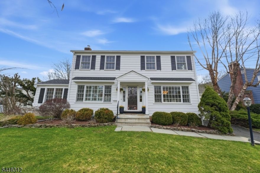 Experience sophisticated suburban living in this impeccably renovated colonial, set on nearly a half-acre of lush, level grounds in one of Summit's most coveted neighborhoods. This turn-key residence offers a masterclass in modern design, headlined by a chef's kitchen featuring a sleek center island, professional-grade appliances, and custom walk in pantry. The open layout flows into a sun-drenched family room with a classic fireplace and an elegant dining room with refined wainscoting. A formal living room, private office, and functional mudroom complete the main level. The second floor is a sanctuary of comfort, featuring a magnificent primary suite with dual custom dressing closets and a spa-like bath with an oversized glass shower. Three additional generous bedrooms share a pristine hall bath near the dedicated laundry suite. The lower level expands the living space with a versatile recreation room boasting a wet bar and stylish herringbone flooring. Outside, the property transforms into a private resort with a level yard, expansive stone patio, built-in fire pit, and architectural pergola for alfresco dining. Located in Summit's top-rated school district with seamless NYC transit access, parks, recreation and a bustling downtown!