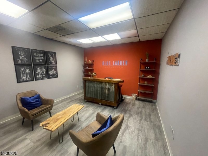 Renovated, former marketing suite witharge reception area, 3 private offices, conference room, file room, computer room, parking lot behind building, break area. Downtown 2nd floor elevatored building, close to restaurants, shops, post office.