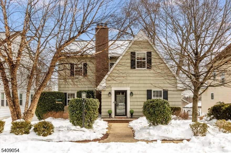 Just unpack your bags and move right in to this beautifully renovated sun-filled home!  A blend of classic charm and modern ease, 381 Essex offers a layout that feels both expansive and effortless. The newly renovated open concept kitchen with a large marble island, recessed lighting & stainless steel appliances, flows into generous living and dining spaces with a Biofuel fireplace plus a dedicated den/office with built-in shelving, a mud area/foyer complete the 1st level. Upstairs you'll find a primary bedroom with ensuite bath, 3 additional bedrooms, (one with adjoining sitting room with built in bookcases) and a hall bath plus an oversized linen closet. The finished lower level adds valuable bonus space with a rec room with new flooring and access to outdoors, a powder room, an exercise room with high ceiling, a laundry room and utility/storage room. Central air, newly finished hardwood floors, a 2-car garage and lovely yard complete this home. Situated in the highly desirable Brookdale section of town close to Brookdale and Lion's Gate Parks, this is a Commuter's Dream with easy access to NYC via bus or train. This one checks every box!