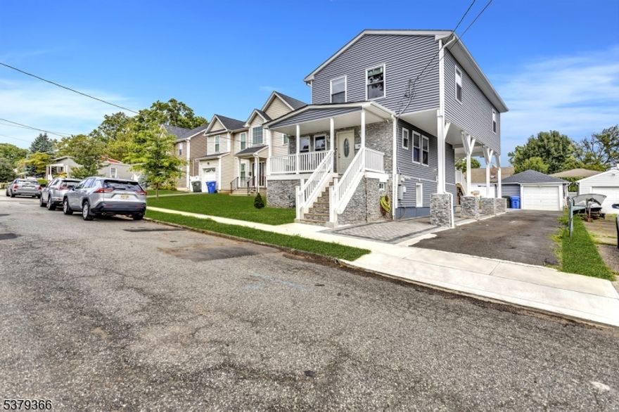 This updated Colonial Style home complete with a front porch, has been thoughtfully redesigned from roof to basement, offering style, functionality, and comfort throughout. Main Level: Step inside to an inviting open floor plan featuring a modern kitchen with a center island, quartz countertops, stainless steel appliances, and tasteful lighting. A  separate dining area flows seamlessly to the living space, with sliders opening to a deck and back yard, perfect for entertaining. A convenient powder room completes the main floor. Second Level: Upstairs, you'll find three spacious bedrooms and two full baths, including a luxurious primary suite with walk-in closet and private bath. A laundry room on this level adds ease to everyday living. Lower level: The finished lower level provides additional living space with a full bath, rec/family room, and plenty of storage--ideal for guests or home officeExterior & Garage: One car oversized garage with a separate storage area offers practicality. While beautiful paver walkway lead from the front of the home down the side to the back paver patio and yard, adding curb appeal and outdoor charm. All appliances are 2024! Energy efficient Tankless Hot Water Heater.  With every detail UPDATED & MOVE-IN ready, just pack your bags and call this your," HOME SWEET HOME."
