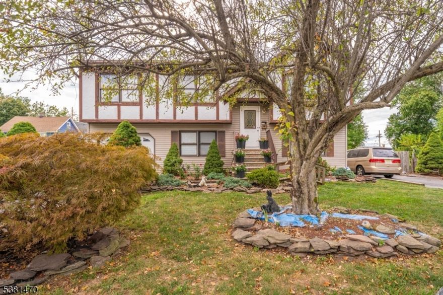 A MUST-SEE IN PERSON ! This bi-level home features a bright layout with spacious 4 bedrooms and 2 and half bathrom . The upper level is designed for everyday living, while the ground level offers one additional bedroom that provide flexibility for guests, a home office, or personal retreat space. A walk-out leads directly to the backyard, where a generous yard framed by mature greenery creates the perfect setting for outdoor enjoyment.The 2 driveways are a big plus .