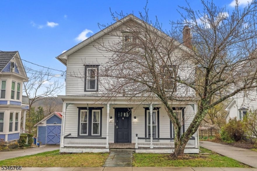 Charming 4-bedroom, 2.5-bath historic colonial with a spacious office, located in the downtown area of quaint Blairstown. This home features an updated kitchen and baths, including a stainless steel farm sink, dishwasher, and white cabinetry. Enjoy beautiful engineered hardwood floors on the main level and luxury vinyl plank flooring upstairs. With covered front and rear porches, you'll have plenty of space for outdoor relaxation. With a driveway on each side of the house along with on-street parking, you'll have plenty of space for visitors! The detached 2-car garage includes a workshop, and the property boasts a new septic system, thermal windows, and white aluminum siding. Public water adds convenience. A perfect blend of classic character and modern upgrades!