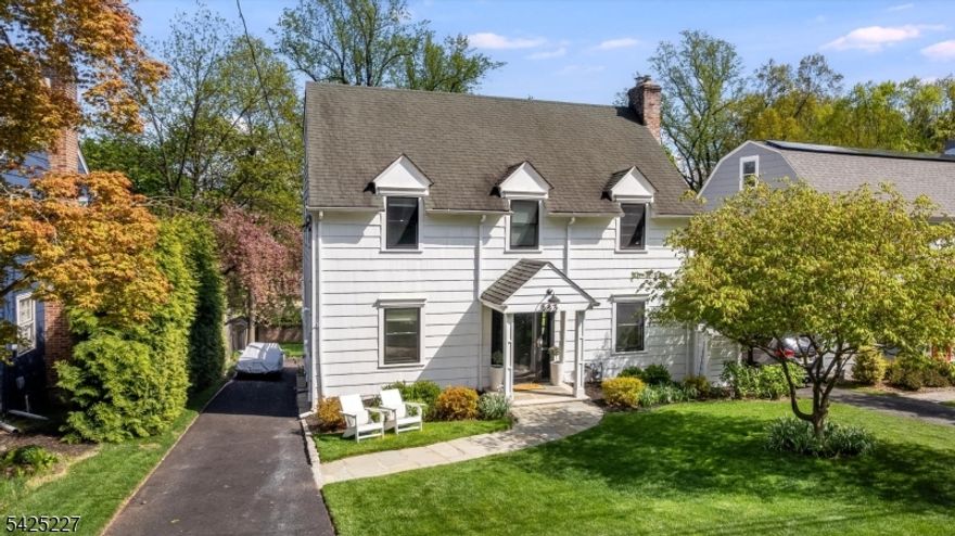 Prim, proper and perfect Upper Montclair colonial on stately Highland Avenue. Ideally located, this 4-bedroom, 4 full and 1 half bath home delivers modern living with thoughtful design throughout. The beautifully renovated kitchen offers abundant cabinetry that flows into the dining area, creating a seamless and functional layout for both everyday life and entertaining. Step outside to an elevated deck with great indoor-outdoor flow, overlooking an impressive 175' deep yard. A light-filled living room with cozy fireplace, powder room and sunroom complete the first level. Upstairs, the second floor features three bedrooms, including a primary suite with a walk-in closet and full bath. The third floor offers a bright and airy retreat with an additional bedroom and full bath. The walkout lower level provides even more usable space and includes a one-of-a-kind greenhouse for year-round enjoyment. Finished in a neutral palette and equipped with central air, this home is just moments from Montclair's vibrant downtown, NYC train and bus lines, top dining and shopping, Mills Reservation, and easy access to Routes 46 and 3.