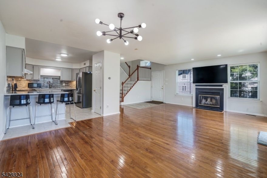 Welcome to this bright and beautifully maintained end-unit townhome located in the highly sought-after Montgomery Township School District, a Blue Ribbon"recognized school district. Filled with natural light, the open and inviting layout features spacious living and dining areas perfect for both everyday living and entertaining. The upgraded kitchen is beautifully appointed with quartz countertops, wide sink, upgraded ventilation hood, a peninsula, newer stainless steel appliances including a newer refrigerator and dishwasher a pantry, and a bright breakfast area with sliding doors leading to the backyard. The adjoining living room offers a warm and inviting atmosphere, complete with a cozy gas fireplace and an open-concept feel ideal for gatherings. There's an additional family room on the first floor which adds to the comfort. Upstairs, you'll find three generously sized bedrooms, each featuring ceiling fans and recessed lighting. The main bath has been tastefully updated with modern finishes. The primary suite provides a spacious retreat with a walk-in closet and a luxurious ensuite bath showcasing dual vanities, a stand-alone soaking tub, and a separate shower. The fully finished basement, which was finished a year and half ago, adds valuable additional living space perfect for a home office, recreation room, gym, or guest area along with excellent storage options.