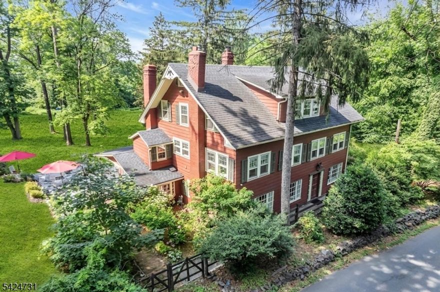 Welcome to a truly rare and irreplaceable offering The Lambert Mill House, a one-of-a-kind historic estate dating back to 1737.Set on approximately two breathtaking acres in the heart of Scotch Plains, this storied property is framed by a picturesque running brook along two sides, creating a private, nature-filled retreat rich with tranquility and wildlife.Originally known as "Old Windmill Farm,  this property once spanned over 110 acres and operated as a mill producing cider, spirits, and flour. By the early 1900s, it was thoughtfully transformed into a residence preserving its heritage while evolving into an extraordinary home.Today, this 5-bedroom, 3 full bath home offers approx. 3,800 sq ft of character-filled living space where historic craftsmanship meets modern comfort. Wide-plank hardwood floors, 18-inch-thick exposed brick walls, and dramatic 30-foot chestnut beams create a truly unforgettable interior.The original kitchen is enhanced with updated appliances, plus a dedicated cook's room with commercial-grade stove. A newly renovated primary bath and recently added mini-splits bring modern comfort.Enjoy seamless indoor-outdoor living with a bluestone patio overlooking lush grounds and flowing water. Additional features include an attached garage, ample storage, and flexible three-level living.Close to downtown Westfield, parks, top schools, and NYC transit. Potential subdivision (buyer due diligence).A true legacy property rarely offered.