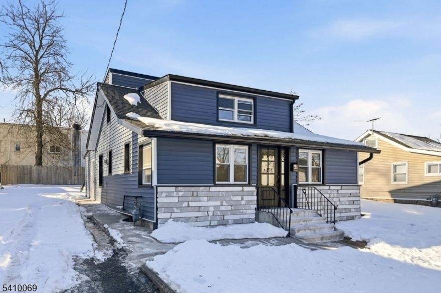 Turn-key 4 bed, 2.5 bath beauty with everything brand new: roof, windows, shutters, vinyl siding, central air, forced hot air heat. Gorgeous wood floors, recessed lighting, crown molding. Spacious living room with electric fireplace. Gourmet kitchen featuring custom white cabinets, quartz counters, marble backsplash, and full appliance package. Convenient first-floor laundry + two bedrooms (one with direct backyard access). Upstairs primary suite with double closets plus another bedroom. Two full baths with stall showers, plus first floor half bath. Private backyard with shed, one-car driveway. Public utilities. High-quality work. Move right in nothing to do but unpack!