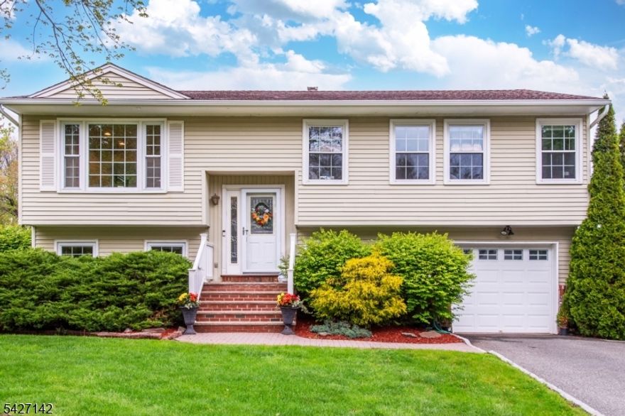 Pristine, Stunning, well maintained home in a very desirable section of Lake Hiawatha.  Neighborhood has underground electrical wirings. It features: 4BRs, 2Fbaths, engineered hardwood floors thru out the house, central air, updated kitchen and baths.  Steps away from Volunteers Park, Tesla charger in the garage and home warranty for appliances and furnace - another 3 year left with coverage of $11,000.  An opportunity to avail the Lake Hiawatha membership club. NOT IN FLOOD ZONE