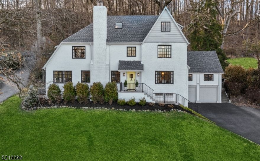 Welcome to this exquisitely renovated 6 bedroom, 5.5 bath tudor.  Situated on 0.64 acres on the uphill of sought after Highland Avenue, it boasts stunning year round NYC views.  Experience the privacy of a yard that backs to a small forest.  Walk to Upper Montclair train.  Enjoy a formal living room with fireplace as well as an open concept kitchen to dining to family room. Prepare a feast in the gourmet kitchen with center island, marble counters, Thermador range, breakfast nook, farm sink, pot filler, coffee bar, wine ref and more. Get ready to host parties in the bar sunroom leading to an extra large patio that connects to sliders off the kitchen.  Upstairs, relax in a luxurious primary suite with lounge and two WICs.  Rejuvenate with a daily spa bath experience with rain shower, soaking tub, 11ft double vanity and toilet closet.  The 2nd fl boasts two more large bedrooms both with en suite full bathrooms while the 3rd fl features three more.  Host guests in the large suite with attached full bath.  Perhaps use the other two bedrooms as dream work-from-home offices with inspiring views.  And theres more!  The finished walk-out basement has a rec room, game room, kitchenette, full bath, gym, mudroom, laundry and storage.  As part of the extensive renovations in 2019, the house was upgraded with new two-zone central air and heat, tankless water heater, all new plumbing and electric, roof, driveway, paint, landscaping, garage doors and more.  A rare Montclair opportunity!