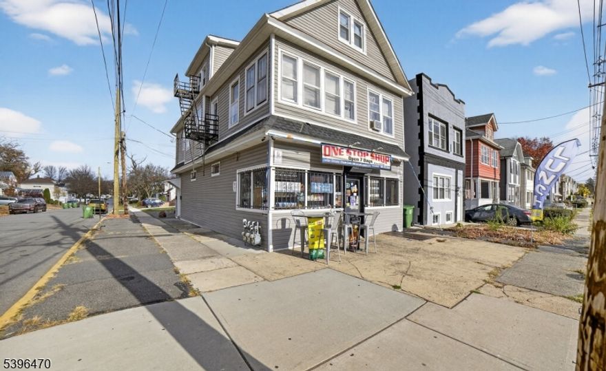 Fantastic opportunity to own a well maintained 3 unit mixed use property featuring both residential and commercial income. The first floor is occupied by a neighborhood convenience store, providing steady foot traffic and reliable rental income. The second floor offers a spacious two bedroom apartment, while the third floor features another two bedroom unit that has been recently updated and is currently vacant, allowing flexibility for an owner occupant or the ability to select a new tenant. Major improvements were completed in 2019, including a new roof and new siding, ensuring peace of mind for years to come. The building has separate utilities, with tenants paying their own heat, gas, and electric, minimizing owner expenses. There is a one car garage also. Best of all, this property qualifies for FHA financing due to the greater residential square footage making it an ideal choice for an investor or owner occupant looking to live in one unit and let the others pay the mortgage. A solid investment in a strong rental market!