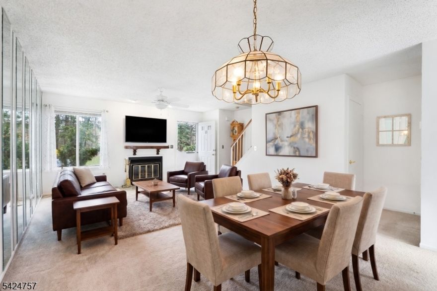 Welcome to this well-maintained townhome in the Westbrook Woods community.  The main level features a living room with a wood-burning fireplace and a kitchen with granite countertops and a rear sliding door leading to a private deck and open landscaped grass area.  The finished basement includes a bar, in-unit laundry, and multiple storage closets, offering flexible additional space.  Upstairs, the main bathroom has en-suite access from the primary bedroom.  81 Woodland includes two assigned parking spaces directly in front of the unit for convenient parking and easy access to the home.  The community also offers tennis courts for residents.