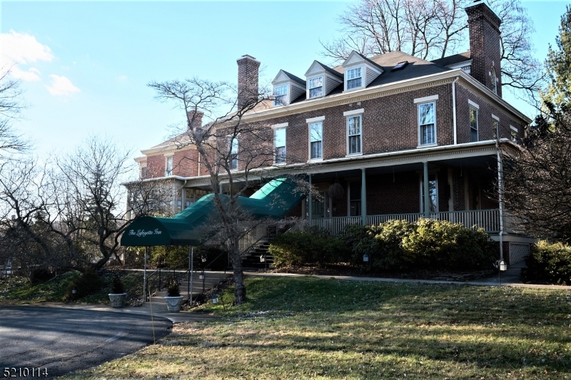 Lafayette Inn is a magnificent Georgian Colonial mansion situated in the heart of College Hill, adjacent to Lafayette College campus. Fantastic location to take advantage of Easton's world-class dining scene. There are walkable main street and shops as well as many hiking and biking trails throughout the area. This 18-room inn offers en-suite king and queen guest rooms spacious gathering, dining, and meeting spaces, and ample off-street parking. Beautiful living room space with gas fireplace, breakfast room, and prep-and-serve kitchen for guests' enjoyment. Wrap-around porch and gardens. Each unit offers modern heat and AC. Several suites with decorative freestanding gas stoves. Off street parking is available onsite, with 23 spots available in the adjacent parking lot. The Lafayette Inn is a well-established and profitable small hotel/inn.