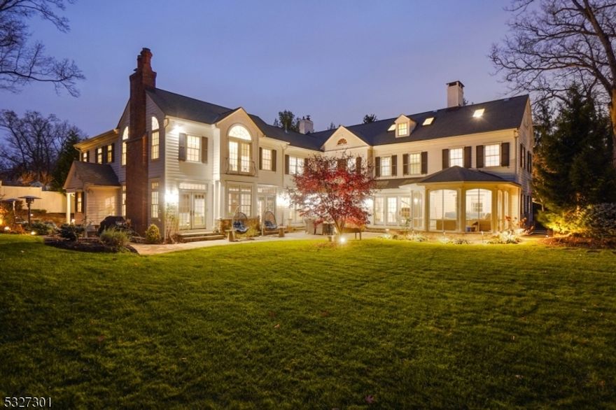 MAGNIFICENT CUSTOM-BUILT COLONIAL * Majestically perched atop 0.74 acres, this 8,060 sqft home has under-stated elegance, a thoughtfully designed floor plan, beautiful architectural details & is located on a preeminent street in the heart of Old Short Hills. It boasts light wood flrs, an open concept floor plan, 4 fire places,1st flr library/office, spectacular kitchen-family room & French doors that let in an abundance of natural light into every room. Entertain by the living rm fireplace, host in the elegant dining rm, toil in the library or unwind in the open kitchen-family room; this home has room for all. The state-of-the-art kitchen has custom cabinetry, top appliances (Dacor, Sub-Zero, Bosch), center island w/ quartz counters & bar seating, breakfast room, sitting rm, 2 pwdr rms, mudroom & 2-car garage. Head upstairs to find 6 BRs, 4FBs & new laundry. The luxurious Primary Suite has its own wing with two WICs, a private exercise rm & a newly renovated spa-like bath w/ two vanities, custom marble floor/tiling, soaking tub & over-sized glass shower. The 3rd flr is a full suite w/ bedroom, sitting rm & newly renovated full bath. LL: huge rec room, 2nd laundry & game room. Step outside: the Bluestone patio is an outstanding entertainment space, nestled amid lush lawns & perennial gardens (room for a pool!). Close to downtown Millburn, top-rated schools (Hartshorn Elem) & SH trains to NYC. This spectacular estate is both an architectural masterpiece & a private sanctuary.