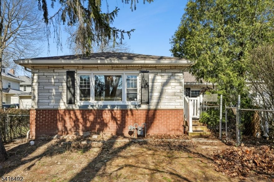 Opportunity in desirable Rutherford! This 3-bedroom, 2-bath ranch offers excellent potential for buyers looking to renovate or customize a home to their taste. The home sits set back from the street, offering added privacy, and features a long driveway providing ample off-street parking. Inside, the property offers a functional single-level layout with a partially finished basement that provides additional flexible space and storage.  The yard configuration is unique, with the primary outdoor space located in the front of the home rather than a traditional backyard. Ideally situated approximately 1 mile from the Rutherford train station and close to major highways, making commuting convenient. With the right vision and updates, this property presents a strong opportunity to create value in a sought-after Bergen County location.