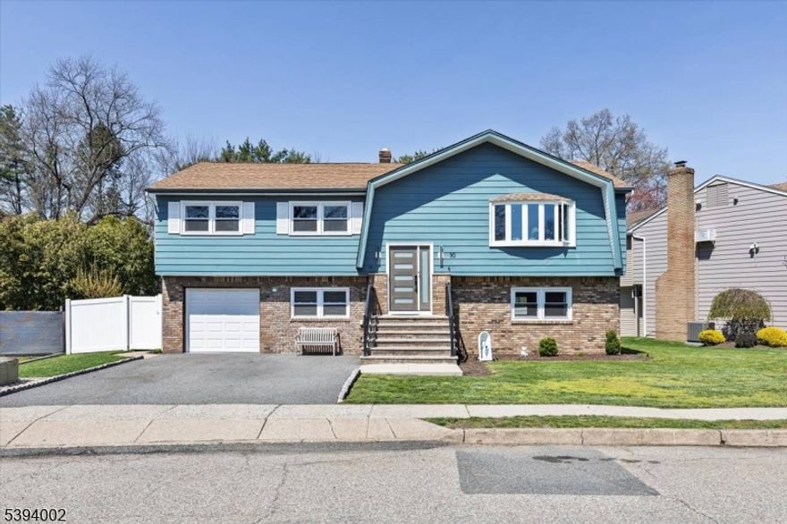 Nothing to do but unpack your bags and move in! Totally renovated bi-level in Totowa. First level features 3 good sized bedrooms, updated eat-in kitchen w/ breakfast bar, quartz counters, tile back splash, stainless steel appliances & beautiful ceramic tile floors.  Living Room w/recessed lighting and new bay window, Formal Dining Room with w/sliders to deck, Hardwood floors throughout, Pull Down attic with steps, Primary Bedroom w/primary bath, which offers double vanity &separate stall shower. Ground floor, which walks out to patio offers large family room, vinyl laminate floors, an office, bar, laundry area and full bath. Nice sized private backyard with vinyl privacy fence. 1 Car Garage, parking for up to 4 cars in driveway. new windows(except for DR), newer roof, new front steps. 200 amps electric.  Close to major highways, shopping and transportation. Your search ends here. Absolute mint condition!  Refrigerator in kitchen not included. Refrig on lower level will stay.