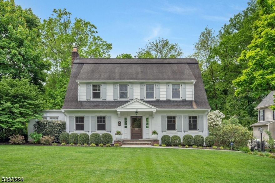 Welcome to your dream home in one of the most sought-after neighborhoods on Summit's Northside! This gorgeous Dutch colonial is zoned for Lincoln-Hubbard Elementary, recently named the #1 elementary school in NJ by US News & World Report. With 5 bedrooms and 2 separate office spaces, 5.1 baths, and 3 fireplaces, this home offers ample flexible space. The open gourmet kitchen with center island and wet bar flows seamlessly into the family room complete with wine fridge and abundant built-ins. A spacious deck with an outdoor TV accessed by double French doors from the family room leads to the inviting flat, private backyard. The kitchen is a chef's delight with Calcutta Gold marble counters and premium appliances, including a separate Sub-Zero tower refrigerator and freezer, a Wolf 6-burner range, and a Dacor wall oven. Next to the kitchen is a convenient mudroom with outdoor side door access. Retreat to the second-floor primary suite overlooking the fully fenced backyard, featuring elevated ceiling heights, an expansive steam shower, dual sinks, and a private water closet. The hall bath is oversized with dual sinks and one of the additional bedrooms has an en-suite bath. The lower level provides even more flexibility, featuring a spacious recreation room, a full bath, ample storage, and a fully equipped laundry room with a fridge, sink, and microwave. A 200K built-in generator provides reliable backup power. This exceptional home combines luxury, convenience, and comfort.