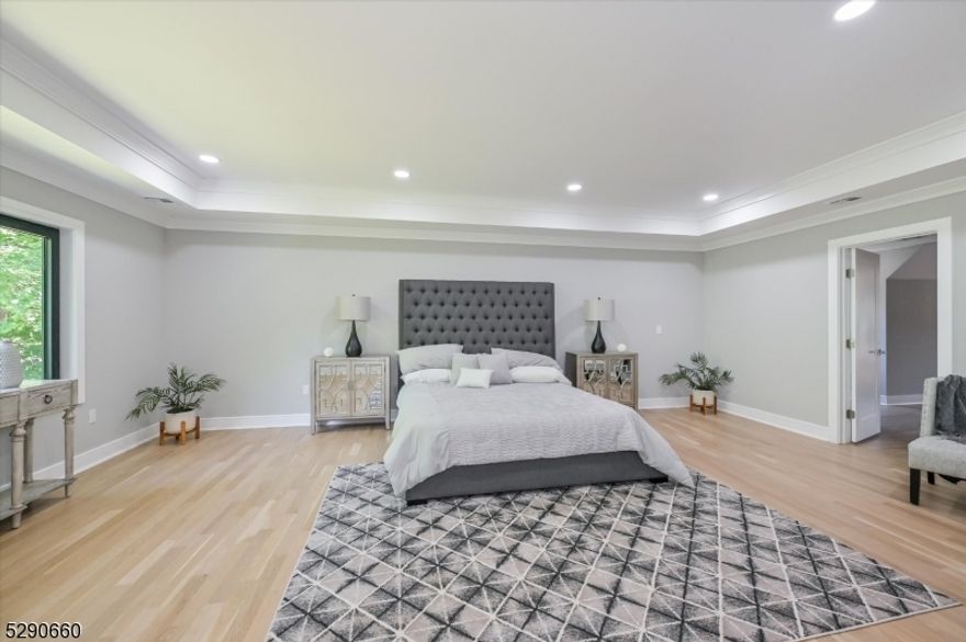 Your dream home awaits! This brand new custom Colonial features 6 bedrooms, 5 full baths & 2 half baths. Entry foyer leads to living room and formal dining room with butler's station that leads into the open concept main living area. This kitchen is suitable for a chef combining modern chicness with functionality! The kitchen offers custom cabinetry, Stainless Steel appliances, center island with bar stool seating and large walk-in pantry for addt'l storage. The open floor plan allows the kitchen to flow seamlessly into breakfast room and family room with fireplace. Powder room is located just off of the family room. 1st floor offers a guest bedroom w/ en suite. Mudroom & access to 3-car garage complete the1st floor. Retreat upstairs to find the luxurious primary suite that will act as your very own private oasis! Taking up the entire right side of the floor, the primary suite features a spacious bedroom with tray ceiling, sitting area and expansive walk-in closet that is fully outfitted with custom shelving, shoe storage and seating area. The primary bathroom offers double vanity, water closet, free standing tub, stall shower w/ seamless glass enclosure and linen closet. 2 addt'l bedrooms on 2nd floor each offer walk-in closets. The 5th bedroom offers en suite and walk-in closet. Laundry room completes the 2nd floor. Full finished walkout basement offers 6th bedroom w/ walk-in closet & en suite, home-gym, rec room, powder room & plenty of storage space!