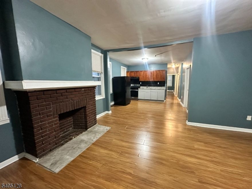 Spacious first-floor apartment in a well-maintained multifamily home featuring three bedrooms plus a bonus room. Enjoy high ceilings and an open-concept layout that seamlessly connects the living room and kitchen, creating a bright and welcoming space. Bedrooms are generously sized, offering comfort and flexibility for various needs. Water is included.Located in the Weequahic section of Newark, this apartment is near local shops, restaurants, schools, and public transportation. The neighborhood offers convenient access to major highways and proximity to Weequahic Park, providing green space and recreational options while still enjoying city convenience.
