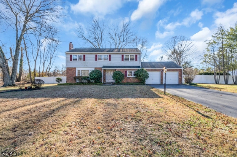 Beautiful 4 Bed 3.5 Bath Turn-Key Colonial with dual Master Suites, Partial Finished Basement and 2 Car Garage in sought after Ewing is sure to impress! Well maintained inside and out with curb appeal in the highly desirable Hickory Hills Estates neighborhood, just pack your bags and move right in! Foyer entry gives way to a spacious and sophisticated interior with hardwood floors that shine, generous room sizes, and plenty of natural light all through. Lovely living room holds a cozy wood burning fireplace, perfect for the season, flowing right into a studious den with built-in shelving and french door access to the outdoors. Large Eat-in-Kitchen offers ample cabinet storage, recessed lighting, breakfast bar, and sunsoaked breakfast nook amidst a charming bay window. Large formal dining room with elegant crown molding makes dinner parties a breeze. Convenient 1/2 bath and laundry closet, too! Upstairs, find the main bath along with all 4 generous bedrooms with plush carpets, inc the dual Master Suites with their own private baths. Partial Finished Basement boasts a versatile rec room for easy entertaining, along with additional storage space. Plush, peaceful, park-like backyard boasts a newly installed privacy fence, with plenty of extra space to expand and play. All just minutes from major commuting roads, amenities, and TCNJ. Don't miss out! This could be your Home Sweet Home!