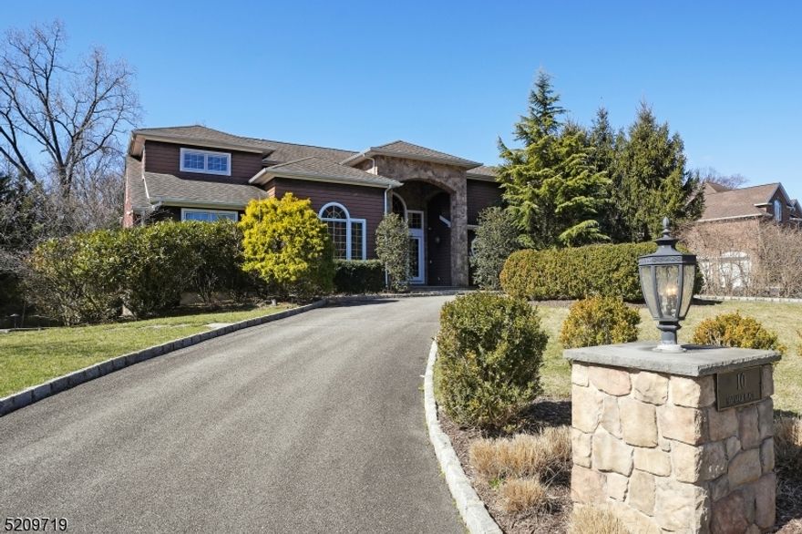 Welcome to this beautiful approx. 7000 sq ft. custom home built in 2008 is set in the prestigious Chestnut Hill section of Livingston and situated on almost 3/4 of an acre of lushly landscaped property, the 5 BR, 4.2 Bath hosts an incredible Gunite heated pool. Resort-style backyard professionally designed with both indoor/outdoor entertaining in mind. The dramatic entry foyer, double doors, and soaring ceilings lead to a FR with gas F/P, a living room, Formal D/R, and Den/ Office. The sensational 1st Fl primary B/R has a tranquil spa-like bath, frameless shower doors, a soaking tub. and two walk-in closets. The gourmet eat-in kitchen features custom cabinetry, granite countertops, large center island, top-of-the-line appliances, and an adjacent butler's pantry with a wine fridge. Two half baths and laundry Rm complete the 1st floor. The 4 BR and two baths are located on the 2nd floor, and the lower level has a home theatre with seating, a bonus room, an exercise room, a rec room, a full bath, and a fabulous custom wet bar. An entertainer's delight! Walk out and experience the stunning backyard oasis, lounge in the heated pool, and your muscles will enjoy the hot tub after working out in the gym. The attached 3 car garage includes an electric charging station. This spacious home and its multi-inclusive areas boasts a mudroom, Generac home generator, alarm system, sprinkler system, and smart home system, including A/V. Not to be missed!