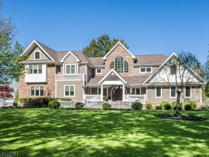 An open front porch invites you into this stunning home with a lovely setting, and prime location on a tree lined street.With major renovation/addition done in 2010, first level includes a two-story foyer with open staircase. Boasting a chefs EIK with a center island with bar sink, built-in drawer refrigerator & freezer, breakfast bar, granite countertops, professional stainless steel appliances, wine fridge, and professional wall oven. A lovely spacious family room features cathedral ceilings with walls of windows overlooking the spectacular backyard, and a private staircase to loft area(possible 6th bedroom).  1st floor En-suite plus two additional bedrooms, full bath, mudroom, laundry room, and powder room complete this level. 2nd level boasts a primary en-suite with 2 walk in closets & access to walkout balcony, plus an additional bedroom, lounge/office area and full bath. The finished lower level offers at home gym, large rec room, and plenty of storage space. Entertainer's dream with a resort like backyard with custom built in pool, hard court basketball court & full service outdoor kitchen. For the most discerning buyer's - this one is truly spectacular!