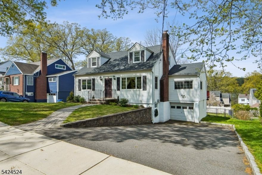 Introducing 29 Lenox Terrace. Located in the highly desirable St. Cloud section of West Orange, on a quiet tree-lined street, this beautifully maintained 4-bedroom, 2 full bathroom home oozes space and charm. This lovely home offers the ideal blend of comfort, convenience, and character. Walk up to the charming paver front porch and step inside to be pleasantly surprised by the expansive open-concept Living, Dining, and Kitchen area. The home features a large eat-in kitchen with excellent counter and cabinet space, perfect for both everyday living and entertaining. The formal dining area opens to an expansive deck overlooking a lovely, flat backyard ideal for gatherings, play, or quiet outdoor moments. The main level also offers two generously sized bedrooms, a full bathroom, and an additional den/office space, providing flexibility for today's lifestyle needs. Upstairs, you'll find two additional large bedrooms and a full bathroom, along with great storage throughout the home. The finished walk out basement adds even more living space with a comfortable family room and an additional office/bonus room. The unfinished area provides exceptional storage and includes direct access to the backyard. Ideally located just a short walk to schools, parks, NYC transportation, the Turtle Back Zoo, and a variety of dining options. Additional highlights include a brand new roof (April 2026), newer HVAC, and updated windows. Taxes for 2025 were $18,580