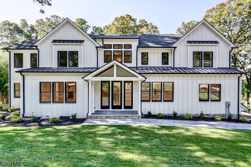 ACCEPTING BACKUP OFFERS ONLY! Welcome to your DREAM HOME! Gorgeous 7 Bedroom 6.2 Bath MODERN FARMHOUSE Colonial w approx. 5,600 sf of finished living space on 3 floors & located on a .52 acre lot on a quiet tree lined street w vista views. Quality craftsmanship & attention to detail is obvious upon entering into this open floor plan living area w a 2 story foyer w dramatic staircase flanked by a formal Dining Room with extensive Millwork & spacious private office w a half bath. Rich HW floors lead to an expansive Kitchen & FR w gas Fireplace w stone surround & decorative mantle & sliders to the expansive patio overlooking the lush backyard, private guest suite w full bath, PR for guests. Kitchen is complete with high-end stainless steel appliances, large center island, quartz countertops, custom cabinetry to the ceiling, Walk through Pantry & Butler's Pantry. The 2nd floor is home to 5 Bedrooms w a gracious Primary Suite with 2 generous walk-in closet & spa-like bath w soaking tub, stall shower & dual sinks, 2 of the other Bedrooms are all en-suites while 2 others share a Jack n Jill bathroom and Laundry. Finished Basement is equipped with a Bedroom, Full Bathroom, Large Recreation Room & Mudroom from the garage & exterior entrance.