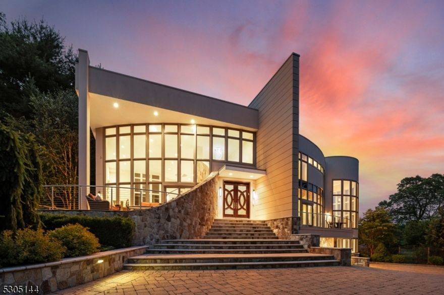 Escape to Chateau Moderna-the perfect juxtaposition btwn mountain & water located in the magical sanctuary of Smoke Rise, renowned for its privacy& natural beauty. Explore this impressive 8,000+ sq ft custom home panoramically situated on 3.79 acres of manicured bliss, featuring 5 beds, 6.2baths, & many luxurious amenities such as paver driveway, koi/lily ponds, & beautiful deck overlooking the landscaping of constant, new bloom. Enjoya contemporary masterpiece drenched in complete sunlight creating spacious living w custom features:Swarvoski-crystal drs, modern window trmnts,automated blinds, gourmet EIK, conservatory/office, gym, sauna, wine cellar, & theatre - all complemented by a priv. backyard oasis w exquisite poolw hot tub, waterfalls & firepit in an exclusive lakefront location.Experience resort-style living in a private community, which includes the Smoke RiseInn, tennis, playgrounds & beach-ready for swimming, boating & fishing all w convenience of 24-hr security.