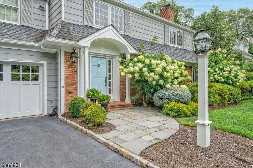 In the heart of Chatham Borough, this exceptional 4-bedroom, 3.1-bath colonial offers endless possibilities with a layout designed for both luxury and comfort. The home features multiple fireplaces, abundant natural light, and a flexible floor plan. Step into the welcoming foyer that opens to a sun-filled eat-in kitchen overlooking the beautifully landscaped backyard and a large screened-in porch. The first floor also includes a grand family room, a spacious living room, a formal dining room, and an impressive library/office with built-in bookcases and storage.  This floor is completed with a powder room and laundry/mudroom with direct garage entry. Upstairs, the primary suite boasts a walk-in closet and a spa-like ensuite bath. A second bedroom also enjoys its own ensuite, while two additional bedrooms share a full bath. The fully finished lower level is an entertainer's dream, complete with a bar, additional leisure space and ample storage. Outside, the manicured, level backyard provides the perfect retreat, featuring a patio ideal for both gatherings and quiet relaxation. All of this is just minutes from Chatham's shopping, dining, schools, and beloved local favorites.