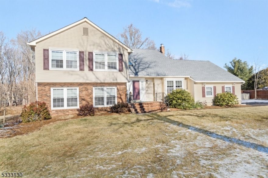 Turn the key and move right in! This stunning 4-bedroom, 2.5-bathroom home blends modern updates with classic charm in the heart of Succasunna. The inviting foyer with a skylight and a vaulted ceiling, welcomes you with style. The foyer, dining room, living room, family room, primary suite and hallways shine with gleaming engineered hardwood flooring (2019). The eat-in kitchen is a chef's dream, offering granite countertops, maple cabinets, a decorative tile backsplash, pantry, and a cozy breakfast area with a bay window overlooking the serene yard. The family room boasts a floor-to-ceiling brick fireplace, a ceiling fan, and sliders to the backyard. An office, first-floor laundry, and powder room add convenience.Upstairs, the primary bedroom includes three double closets and a private bath, while three additional bedrooms with double closets share a well-maintained bath. The 22x22 finished basement rec room offers endless possibilities. Outside, enjoy a 1-year-old patio, pergola, fire pit, a landscaped yard with privacy plantings, a 120 sq. ft. shed, and fencing. With public utilities, natural gas, a new roof, and an emergency generator hookup, this home is truly move-in ready. Located near Routes 10, 46, and 80, and just minutes from Roxbury's recreation center and Horseshoe Lake, this home offers the perfect combination of space, updates, and convenience. Don't miss out!