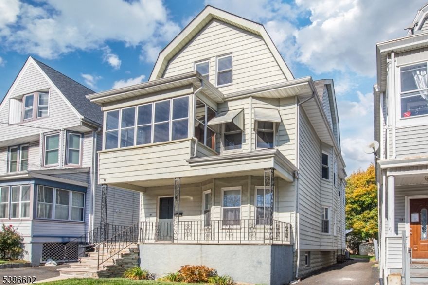 Welcome to one of the LARGEST multifamily homes in the neighborhood! This spacious two-family property offers endless opportunities for owner-occupants or investors alike. The first-floor unit features 2 bedrooms, 1 bath, a comfortable living room, dining area, and a well-appointed kitchen complete with a charming butler's pantry. The second unit spans two stories and includes 3 bedrooms and 2 baths, plus generous living space with a living room, family room, dining room, kitchen with butler's pantry, large storage room, kitchenette, and an enclosed porch. Throughout the home, you'll find beautiful hardwood floors, adding warmth and character. A long driveway leads to a the fenced-in backyard, providing privacy and outdoor space for pets, gardening, or gatherings. Additional highlights include public utilities, natural gas, and a large basement with laundry and abundant storage. Located in an amazing area close to schools, dining, entertainment, major highways, and public transportation to the city, this property truly has it all!