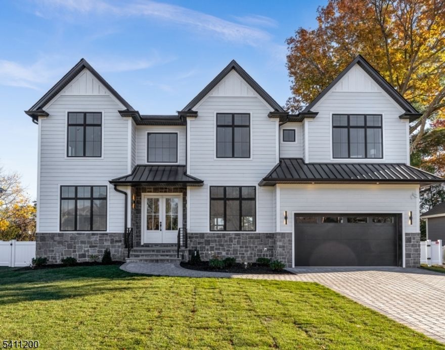 Welcome to 11 Garvey Place, a recently completed luxury masterpiece in one of Bergen County's most sought-after towns. Designed by a renowned local architect, every detail of this 6-bedroom, 5.5-bathroom home is set to reflect high-style interior design aesthetics & quality craftsmanship. Set on a 80x140 lot, this grand center hall colonial showcases a flawless floor plan with 10' ceilings, plus 2-story living spaces, gleaming hardwood floors, oversized Anderson windows, and exceptional attention to detail throughout. At the heart of the home is an open layout consisting of a chef's kitchen with top-of-the-line Sub-Zero/Wolf appliances, an oversized center island, and quartz counters, overlooking an integrated secondary dining space, and a 2-story great room with a fireplace. A two-story foyer, formal dining & living rooms & 1st floor guest ensuite offer seamless flow and everyday comfort for living & entertaining. The primary suite features a walk-in closet & a spa-like bath with a large shower, soaking tub, and double vanity. The finished lower level includes a gym, rec room with a kitchenette, wine cellar, & egress bedroom and full bath. Enjoy an exceptionally designed home all while being in convenient proximity to top-ranked schools, shops, and parks in one of New Jersey's top commuter towns!v
