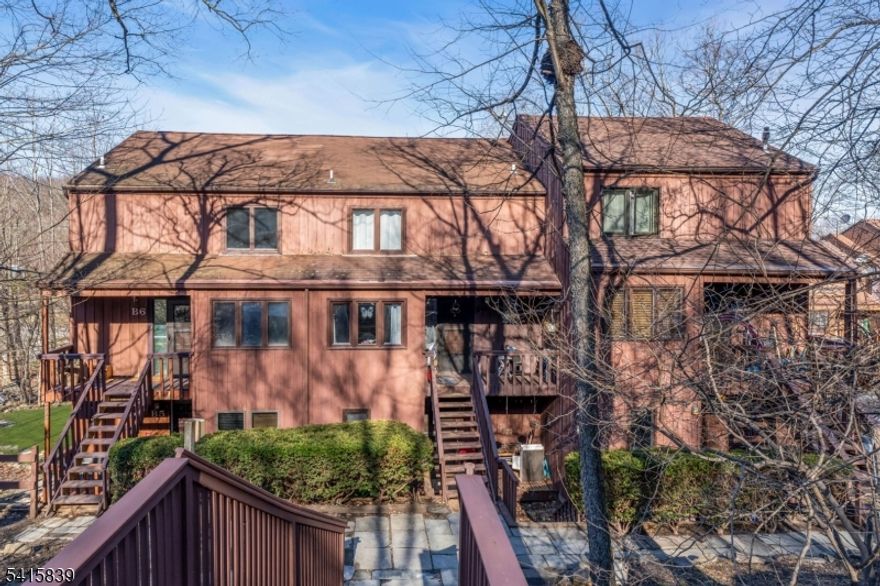 Escape to the peaceful beauty of Vernon with this unique multi-level 1 bed, 1.5 bath condo. Enter through the eat-in kitchen where you'll also find a convenient half bath and laundry room. Upstairs, the spacious living room features soaring ceilings, ample natural light, a cozy wood-burning fireplace, and sliding doors leading to a private balcony. Perfect for enjoying the surrounding scenery with a cup of coffee. The next level offers the bedroom and full bathroom, while the loft above provides a flexible space ideal for an office, guest area, or extra storage. Located just minutes from Mountain Creek Ski Resort, lakes, and parks, this home lets you enjoy the tranquility and outdoor lifestyle of North Jersey year-round.