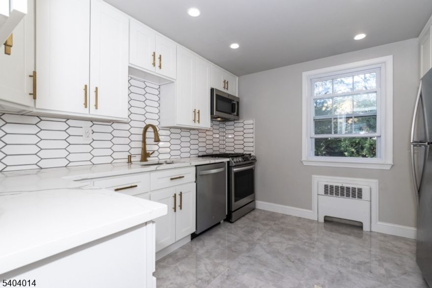 Check out this roomy modern 1-bedroom apartment nestled in the highly sought town of Springfield! Freshly painted, hardwood floors, it boasts a separate kitchen and ample closet space. Bask in the natural light that floods this airy space.   Rent includes heat and water.   Building perks include laundry facilities. Garage parking space. Convenient location, shuttle to train