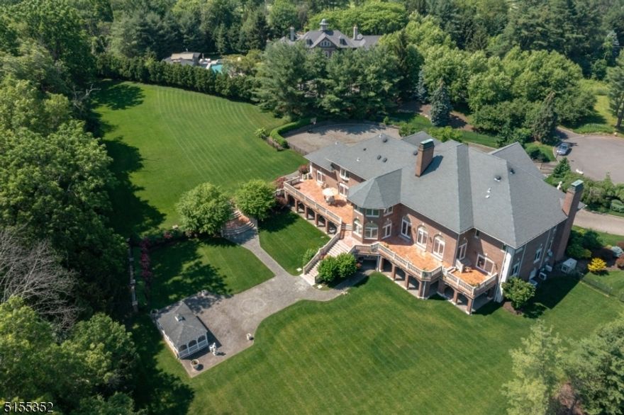 Located in the coveted Country Club Estates section, this spectacular gated estate sits on over 2 acres and is perfectly perched at end of cul-de-sac. As you step inside you are greeted by a two-story foyer where soaring ceilings and luxurious details are on display. As the foyer spills directly into the expansive great room & gourmet chefs kitchen beyond, nearly every room at the back of main level includes sliders to backyard. An expansive primary suite is housed on the 2nd level featuring a dressing room, sitting area with a fireplace and a spa-like bath. A fully finished walk-out lower level and a picturesque yard offers the ideal venue for entertaining.