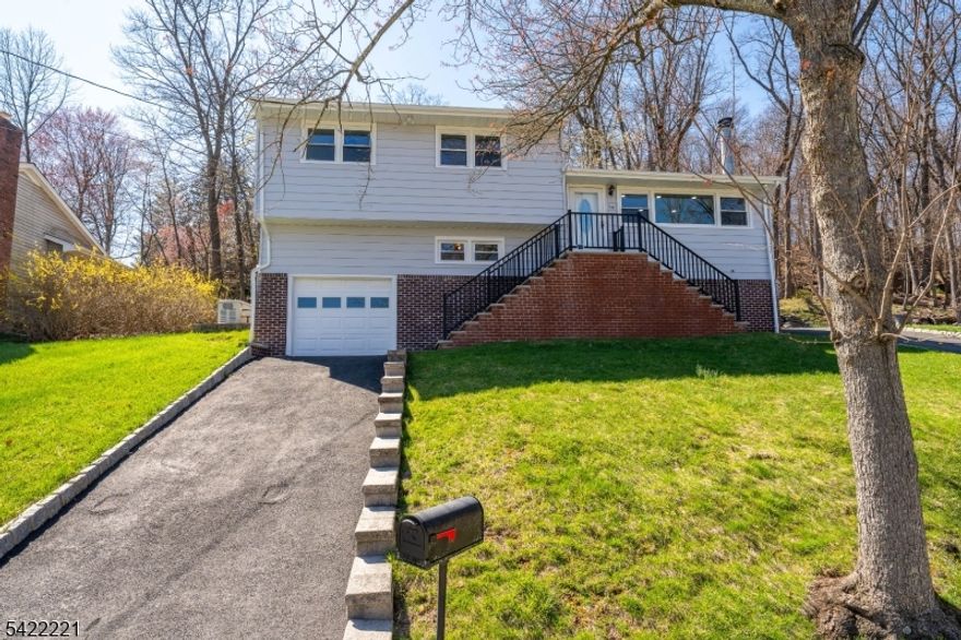 Welcome to 114 Garfield Ave, West Orange, NJ an exceptional 4-bedroom, 2-bathroom residence set across four spacious levels, featuring a newly renovated kitchen, hardwood floors throughout, and central air and heat for year-round comfort. Nestled on a quiet dead-end street in one of West Orange's most desirable and upscale neighborhoods, this home offers a large patio and expansive backyard ideal for entertaining, along with stunning views of the New York City skyline. Complete with two driveways and parking for up to 15 cars, this property seamlessly combines space, style, and convenience. Ideally situated just minutes from the train station, offering direct access to New York City.