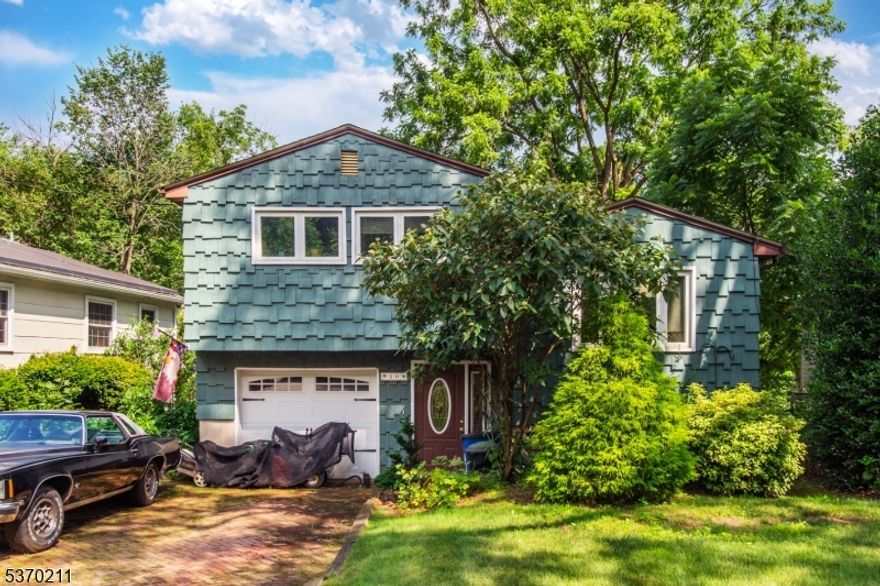 Split Level Home in the heart of Downtown Denville! Hardwood floors throughout. Functional eat in kitchen. Opens to a cozy, yet bright Living Room. Upstairs, a full bath & 3 nice-sized bdrms, generous closet space in each. Downstairs, family room and walkout to backyard. Outside, an enchanting oasis & great entertaining space w/deck. Enjoy the Privacy on the Rockaway River, situated just a short walk to DWTN Denville- offering restaurants, pubs, shops & boutiques. Direct access to NYC from either train to Penn Station or bus to Port Authority. Plenty of parking on & off st+ 1 car garage.