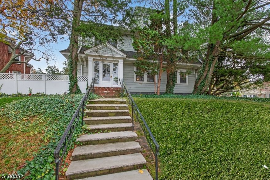 Highest & Best Tuesday 2pm. Just 1 block from Downtown South Orange & 2 blocks from the South Orange NJ Transit Station, this home offers exceptional convenience with a quick Midtown Direct ride to Manhattan, approximately 30-35 minutes to Midtown. SOPAC, the South Orange Public Library, & an array of restaurants & shops are nearby, creating a vibrant setting for daily living.This spacious home includes 5 bedrooms & 3.1 bathrooms across 4 finished levels. The 1st FL features open concept kitchen with a center island that flows into the dining room, which connects to a large living room anchored by a wood burning FP. French doors in the living room lead to a generous side porch, offering easy indoor to outdoor transition. Large rear deck extends entertaining space from the kitchen & is bordered by a privacy fence for enclosed backyard experience. Front & rear entryways include mudrooms for practical storage & transition.2nd FL offers 4 bedrooms, including 1 currently used as a home office & dressing room. The 3rd FL provides additional flexible space which is being used as a dressing room with an adjacent full bathroom. The finished basement offers recreation space, wet bar, bonus room, laundry & full bathroom, creating another level of comfortable living & entertaining.Recent improvements include updates to roof, 3rd FL bathroom & rooms in 2018, deck in 2022, kitchen & basement in 2023, & new water heater in 2025. Driveway, garage, fireplace, chimney & flue conveyed as is.