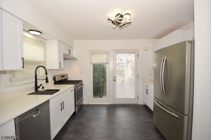 Who wants to be the first person to use this new kitchen with quartz countertops? Just updated throughout! Kitchen offering new floor and shaker style cabinets topped off with quartz countertops with a beautiful stainless steel sink with pull down spray nozzle. Stainless steel finish appliances with a 5 burner gas range and self cleaning oven. New Anderson windows! Four new remote control ceiling fans and new LED lighting throughout. Updated bathroom offering a new vanity with quartz counter, modern light fixtures and new toilet. Interior just painted. Available immediately. Use of driveway and attached direct entry 1 car garage. Includes exclusive washer and dryer. Hardwood floors. High efficiency gas heat and central air. First floor unit with use of yard, deck and garden area. New garage doors and automatic opener. Conveniently located just 0.4 miles from the train station to NYC, 1 block to shopping center and Walgreens, 1/2 block to library and center of town with restaurants and shopping. 4 blocks to downtown Somerville. Easy access to major highways like 202, 206, 22, 287 or 78. 34 miles to Newark Airport. Maximum of 3 occupants. No Pets. No smoking.