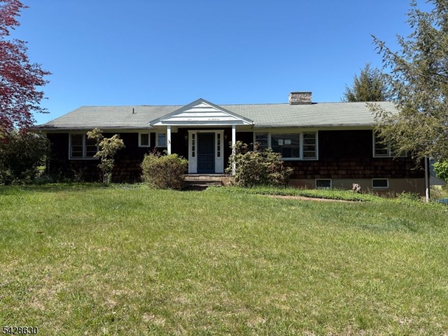 Wonderful opportunity to own an expanded ranch in the heart of Gladstone. Ideally located near the train, major highways, and bus service to NYC, with convenient access to local restaurants, shops, and the Gladstone town center.This home offers an open and spacious floor plan, featuring hardwood floors throughout the main living areas and a living room with a wood-burning fireplace. The expanded kitchen includes a breakfast bar, eat-in area, and access to a private rear deck, providing a great setting for outdoor enjoyment. A formal dining room adds additional space for gatherings and everyday living.The home includes three generously sized bedrooms, all with hardwood flooring. The lower level offers high ceilings and a large open area, presenting excellent flexibility for a variety of uses.Set on a desirable property with a functional layout and strong potential, this home presents a great opportunity to make it your own.